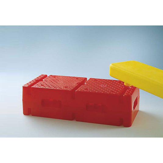 Plastic block with holes and grooves